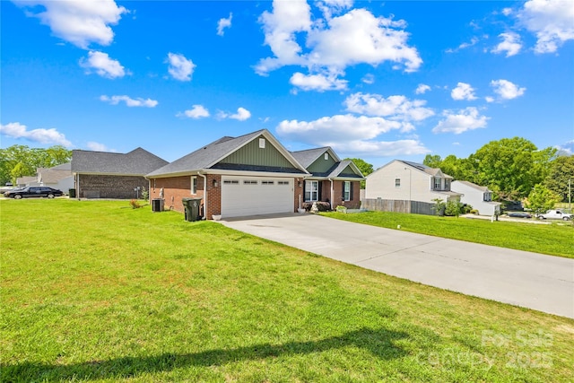 view of front of home featuring brick siding, driveway, a front yard, and a garage