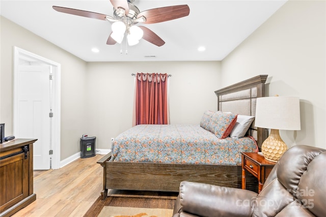bedroom with light wood-type flooring, ceiling fan, baseboards, visible vents, and recessed lighting