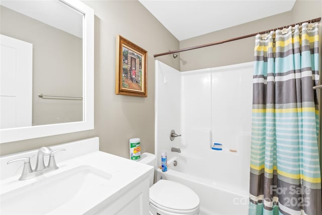 bathroom featuring vanity, toilet, and shower / bath combo