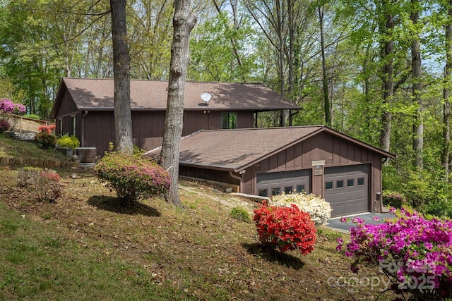 605 Hennessee St, Morganton, NC 28655 - view of front of property featuring roof with shingles, a garage, and cooling unit
