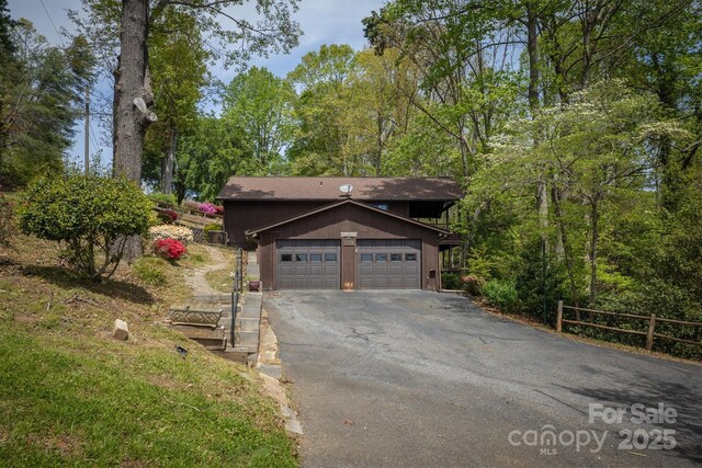 605 Hennessee St, Morganton, NC 28655 - view of front of home featuring a garage and asphalt driveway