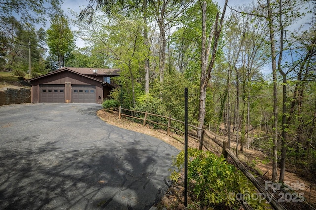 605 Hennessee St, Morganton, NC 28655 - view of front facade with asphalt driveway and a garage