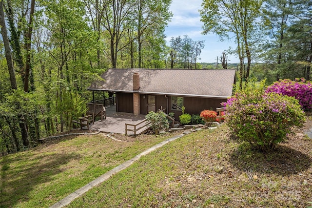 605 Hennessee St, Morganton, NC 28655 - view of front facade with a chimney, a front yard, and roof with shingles