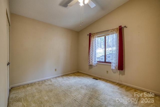 605 Hennessee St, Morganton, NC 28655 - unfurnished room with carpet floors, vaulted ceiling, ceiling fan, baseboards, and a textured ceiling