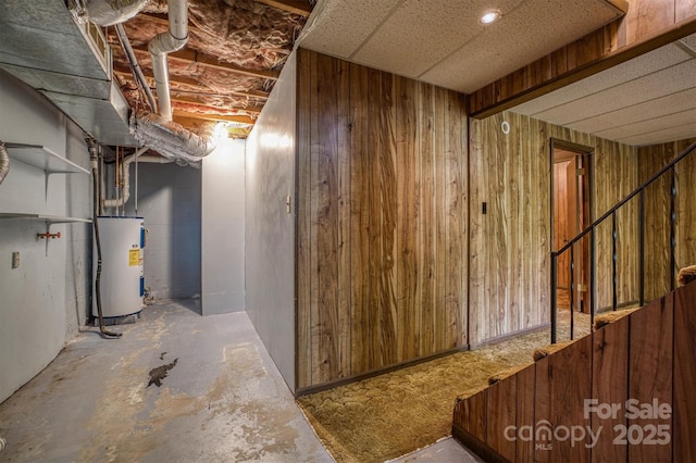 605 Hennessee St, Morganton, NC 28655 - below grade area featuring electric water heater and wood walls