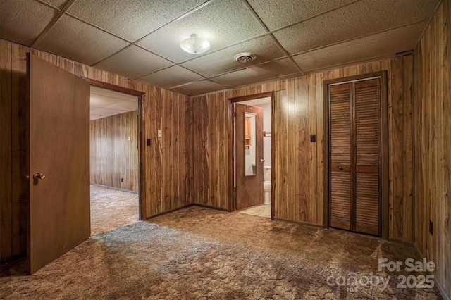 605 Hennessee St, Morganton, NC 28655 - carpeted spare room with wood walls and a drop ceiling
