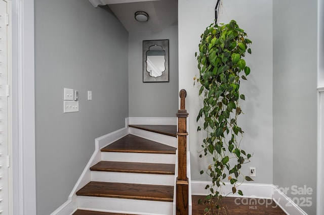 stairs featuring baseboards