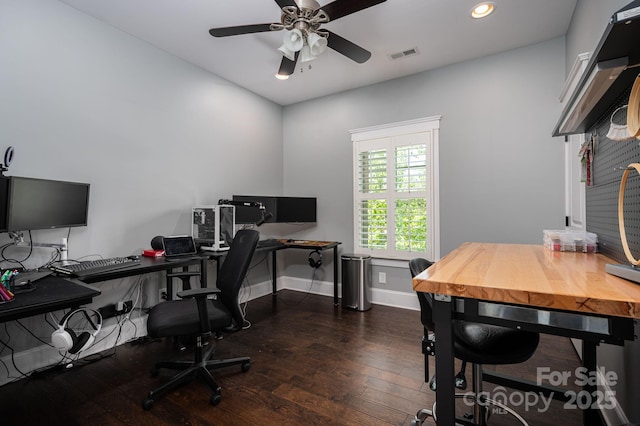 office space featuring a ceiling fan, baseboards, dark wood-type flooring, visible vents, and recessed lighting