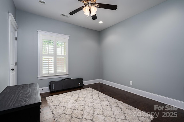 bedroom featuring baseboards, dark wood-type flooring, visible vents, and recessed lighting