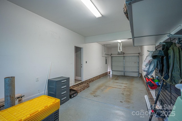 garage featuring baseboards