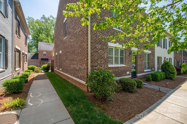 view of home's exterior featuring brick siding