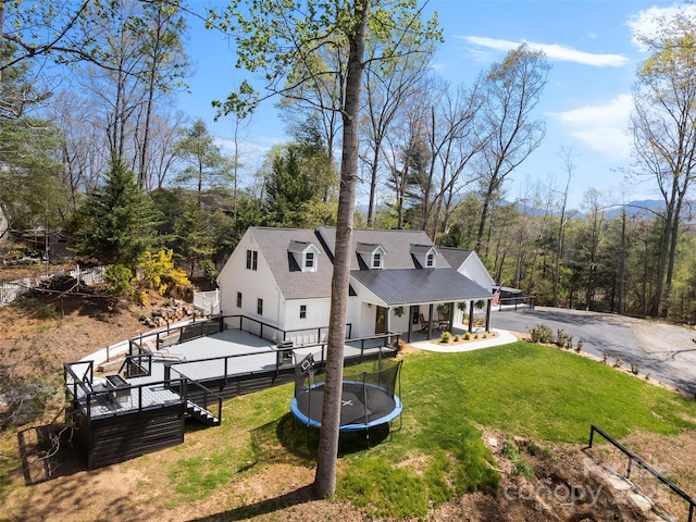 30 Gap Hill Dr, Fletcher, NC 28732 - back of property featuring a trampoline and covered porch