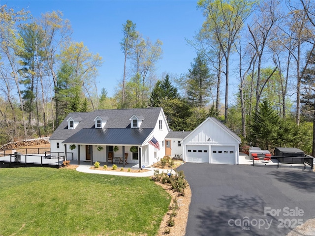 30 Gap Hill Dr, Fletcher, NC 28732 - view of front facade with board and batten siding, a porch, asphalt driveway, and a garage