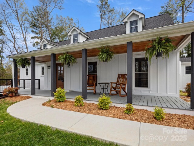 30 Gap Hill Dr, Fletcher, NC 28732 - view of front of house featuring a porch, board and batten siding, and a shingled roof