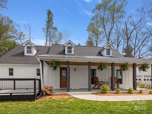 30 Gap Hill Dr, Fletcher, NC 28732 - modern farmhouse featuring a porch, a front lawn, a shingled roof, and board and batten siding