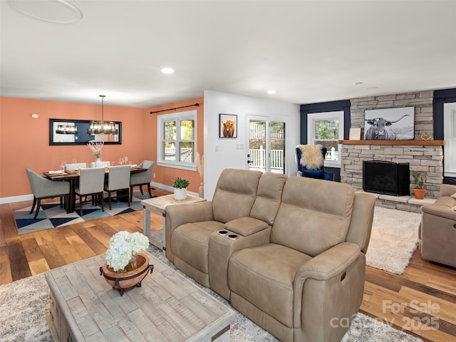 30 Gap Hill Dr, Fletcher, NC 28732 - living room with a chandelier, light wood-type flooring, a fireplace, healthy amount of natural light, and recessed lighting