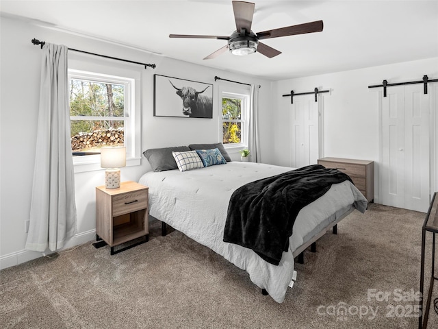 30 Gap Hill Dr, Fletcher, NC 28732 - bedroom featuring a barn door, carpet flooring, and ceiling fan