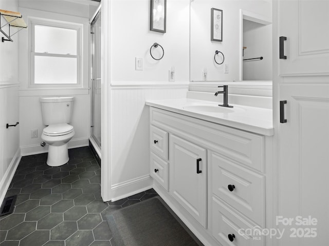 30 Gap Hill Dr, Fletcher, NC 28732 - bathroom featuring vanity, a wainscoted wall, a stall shower, and tile patterned floors