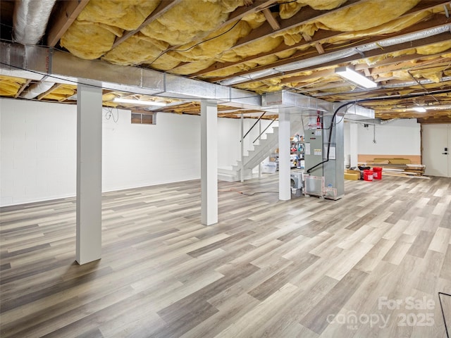 30 Gap Hill Dr, Fletcher, NC 28732 - basement featuring heating unit, stairs, and wood finished floors