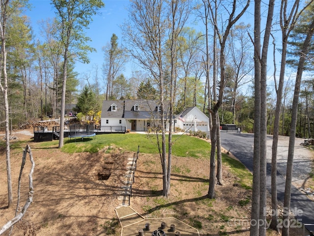 30 Gap Hill Dr, Fletcher, NC 28732 - view of front of property with a trampoline, a front yard, driveway, and a wooden deck