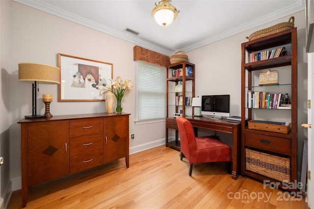 office with light wood finished floors, baseboards, and ornamental molding