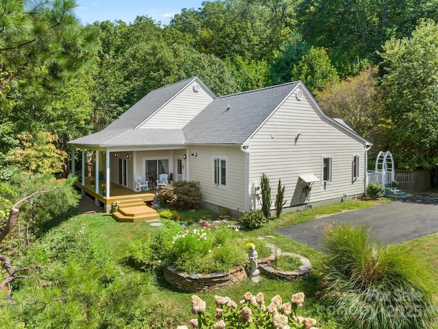 80 Ivy Cove Rd, Fairview, NC 28730 - rear view of house with a view of trees, a shingled roof, and fence