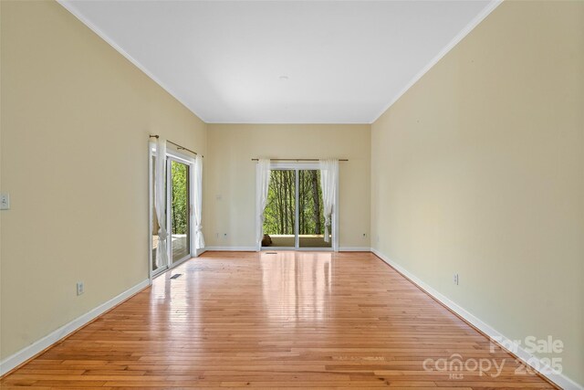 80 Ivy Cove Rd, Fairview, NC 28730 - unfurnished room with light wood-type flooring, baseboards, and crown molding