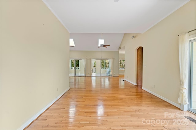 80 Ivy Cove Rd, Fairview, NC 28730 - unfurnished living room with arched walkways, light wood-style floors, crown molding, baseboards, and ceiling fan