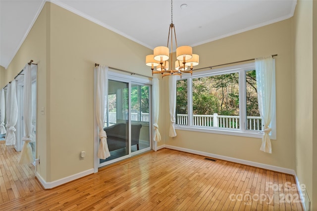 80 Ivy Cove Rd, Fairview, NC 28730 - unfurnished dining area featuring hardwood / wood-style flooring, baseboards, a notable chandelier, and visible vents