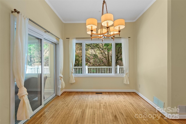 80 Ivy Cove Rd, Fairview, NC 28730 - unfurnished dining area featuring light wood-style floors, visible vents, ornamental molding, and an inviting chandelier