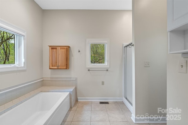 80 Ivy Cove Rd, Fairview, NC 28730 - bathroom featuring a stall shower, a bath, baseboards, tile patterned flooring, and visible vents