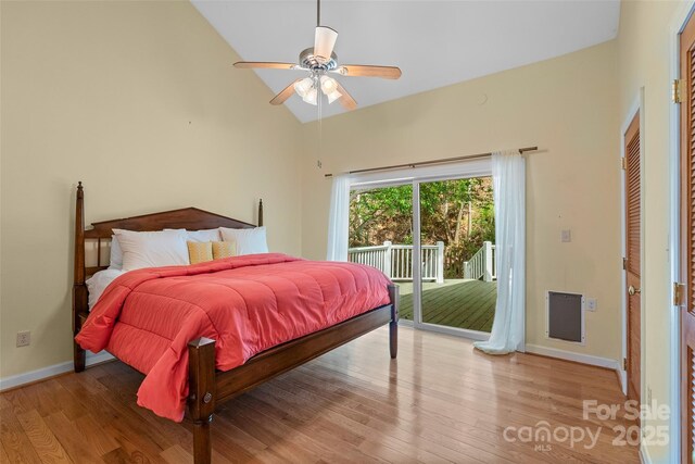80 Ivy Cove Rd, Fairview, NC 28730 - bedroom with access to exterior, baseboards, wood finished floors, ceiling fan, and high vaulted ceiling