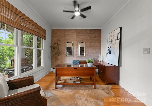 home office with baseboards, ornamental molding, a ceiling fan, and wood finished floors