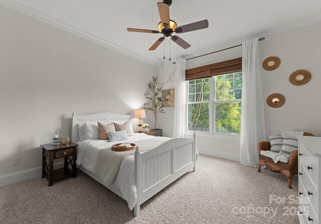 bedroom featuring crown molding, baseboards, ceiling fan, and light colored carpet