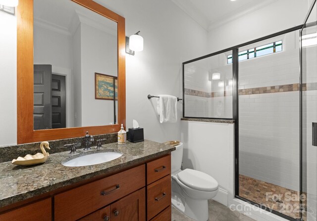 full bath featuring toilet, ornamental molding, and a shower stall