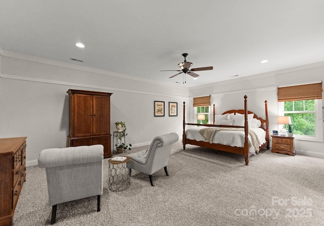 bedroom with baseboards, recessed lighting, and light colored carpet