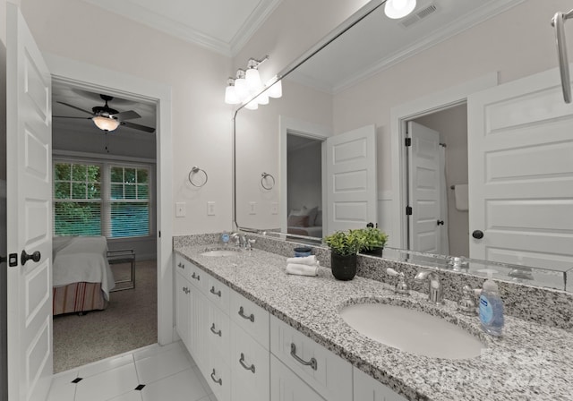 ensuite bathroom featuring visible vents, ornamental molding, a sink, and ensuite bath