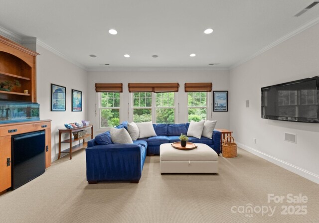living room featuring recessed lighting, light colored carpet, plenty of natural light, and visible vents