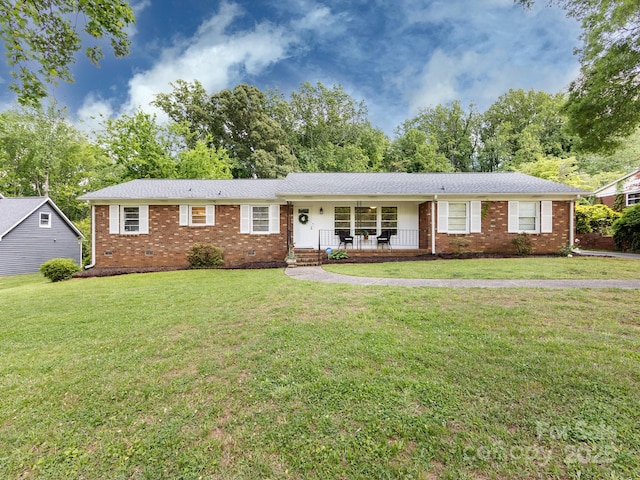 6616 Williams Rd, Charlotte, NC 28215 - ranch-style home featuring covered porch, a front lawn, and brick siding