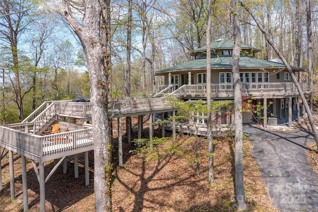 39 Tatham Rd, Hendersonville, NC 28792 - rear view of house featuring a wooden deck, a shingled roof, driveway, and stairs