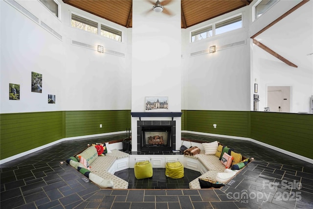 39 Tatham Rd, Hendersonville, NC 28792 - sunken living room with a fireplace, a wealth of natural light, high vaulted ceiling, and wainscoting