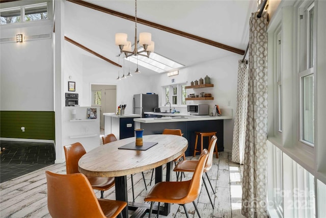 39 Tatham Rd, Hendersonville, NC 28792 - dining area with high vaulted ceiling, a notable chandelier, and beam ceiling
