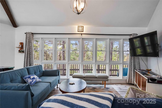 39 Tatham Rd, Hendersonville, NC 28792 - living area featuring a wealth of natural light, wood finished floors, and beamed ceiling