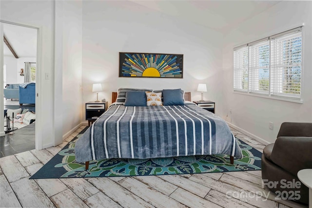 39 Tatham Rd, Hendersonville, NC 28792 - bedroom featuring lofted ceiling, baseboards, and wood finish floors