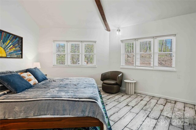 39 Tatham Rd, Hendersonville, NC 28792 - bedroom featuring beamed ceiling, baseboards, and wood finished floors