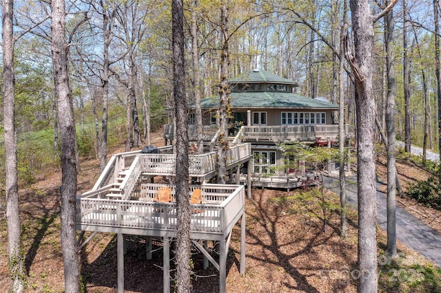 39 Tatham Rd, Hendersonville, NC 28792 - rear view of property with a forest view, a wooden deck, and stairway