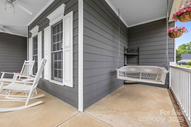 exterior space featuring ceiling fan and a porch