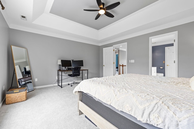 carpeted bedroom featuring visible vents, ceiling fan, a tray ceiling, baseboards, and ornamental molding