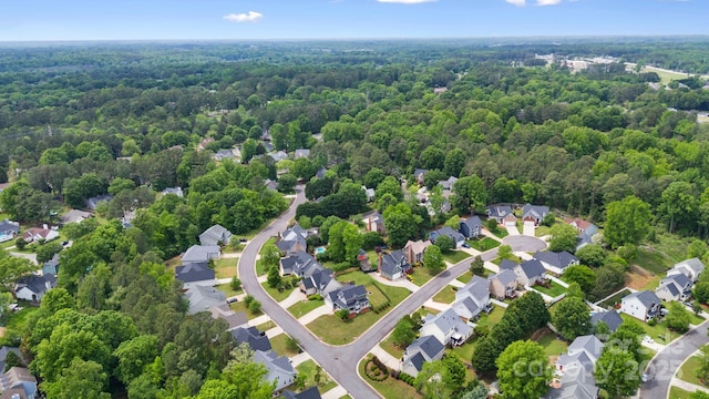 birds eye view of property featuring a residential view and a view of trees