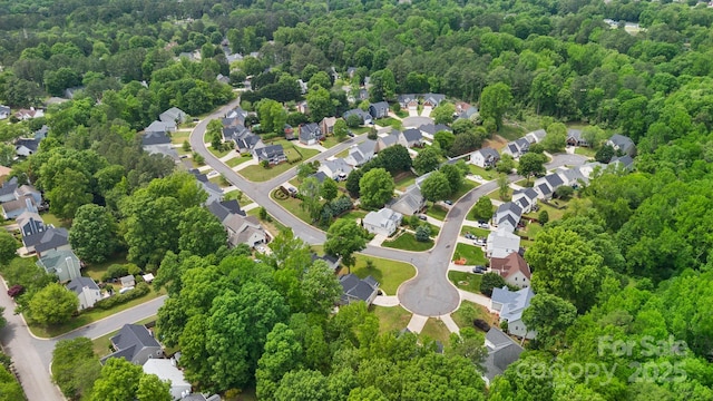 bird's eye view with a residential view and a view of trees